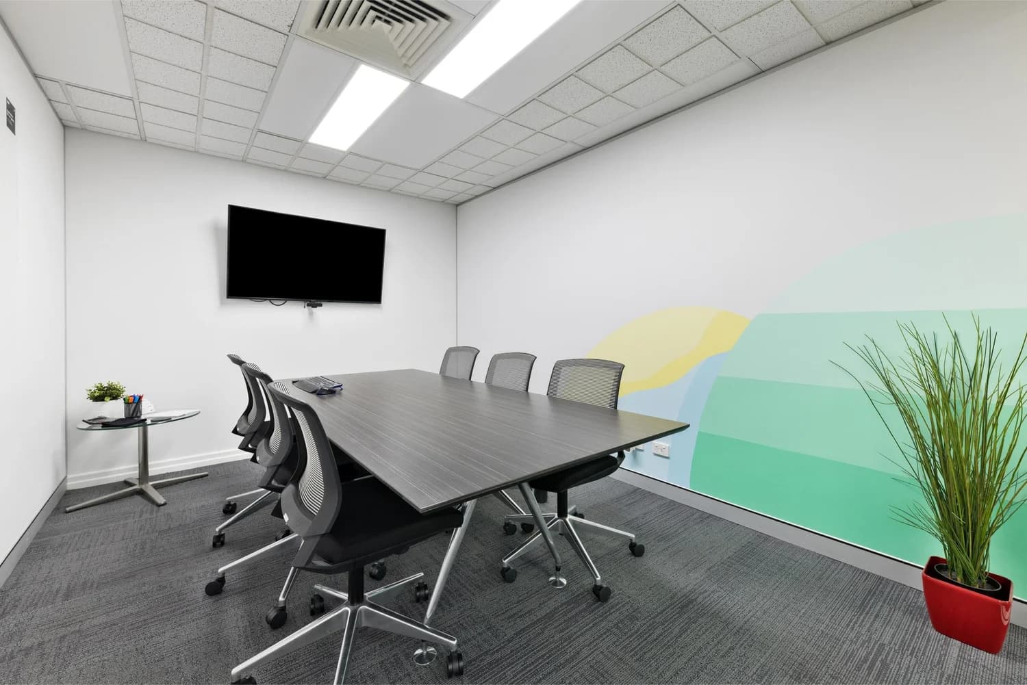 Boardroom with mural wall at LINK Coworking
