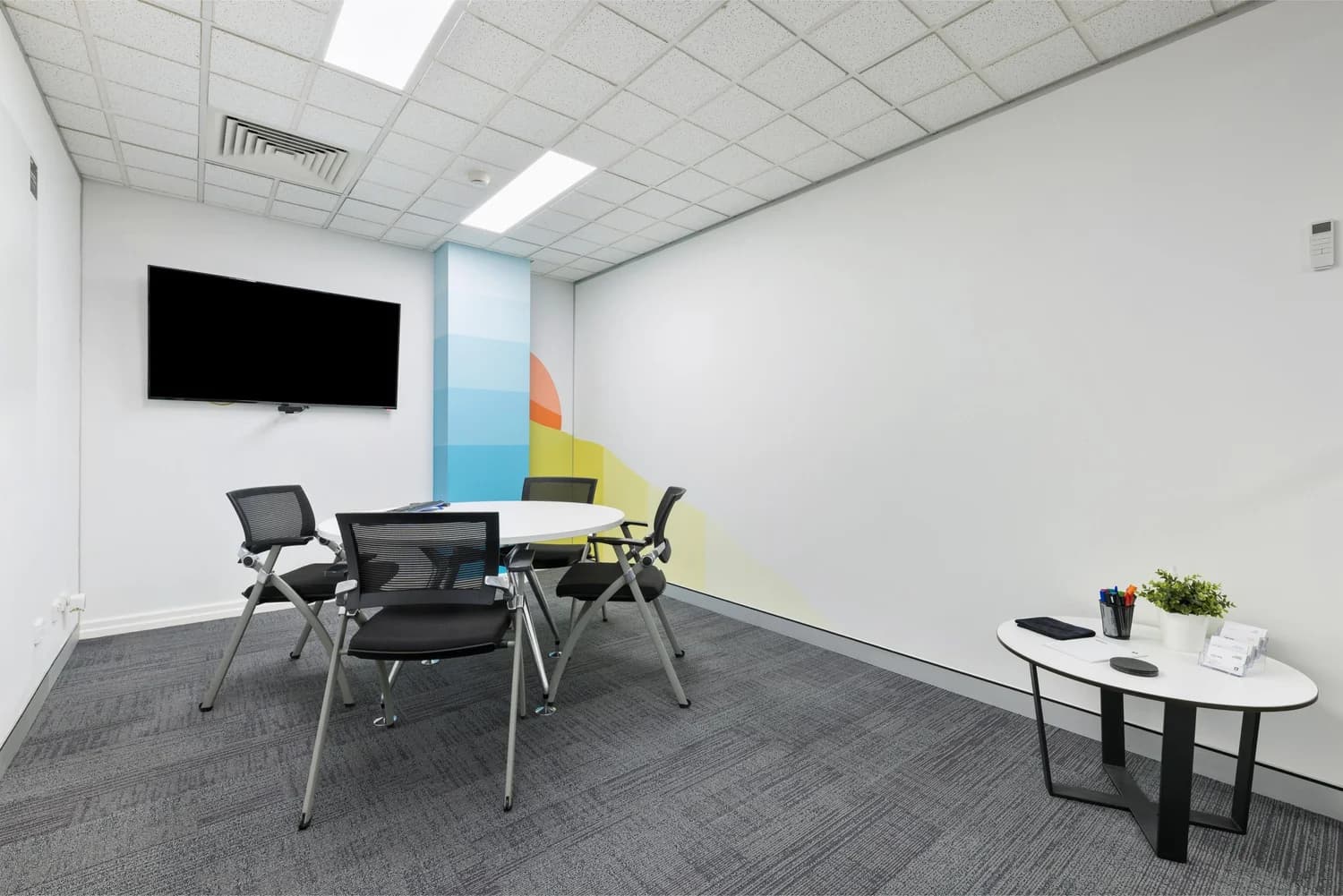Small meeting room with whiteboard at LINK Coworking